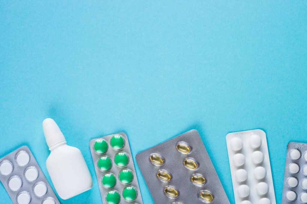 Tablets and medicines on a blue background